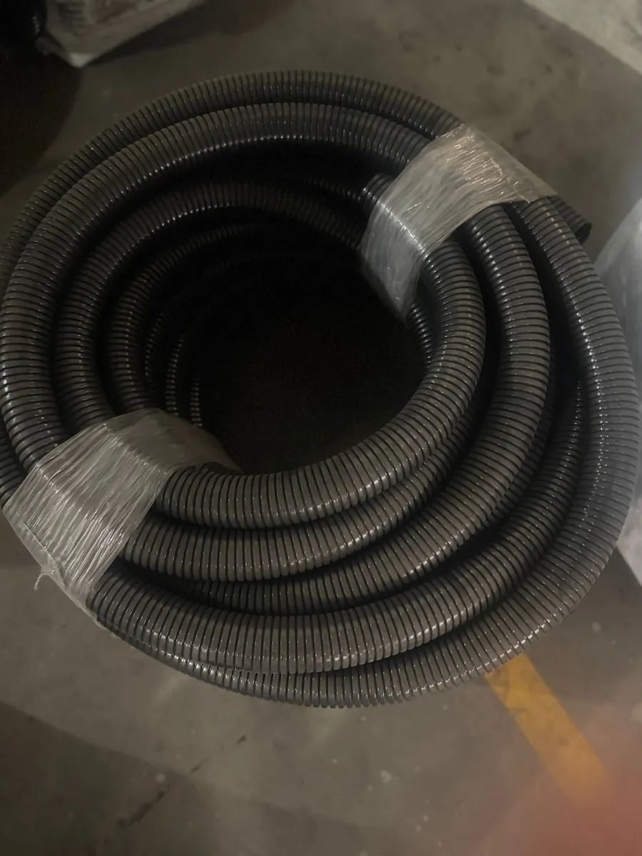 Roll of corrugated flexible conduit, taped for transport